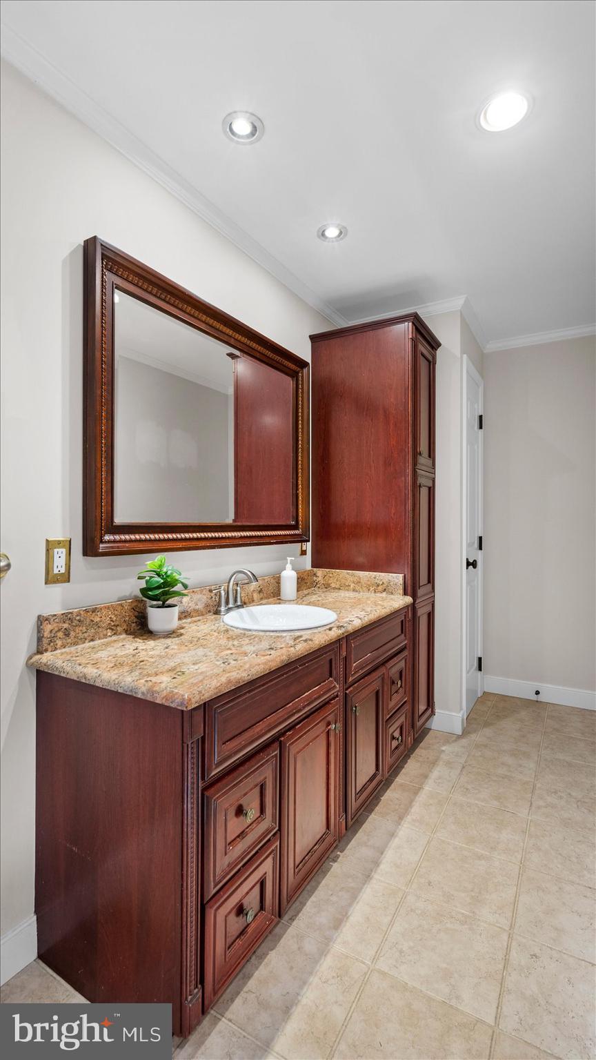 9 Nantucket Garth Phoenix, MD 21131 - Photo 28 of 52 a bathroom with a granite countertop sink and a mirror