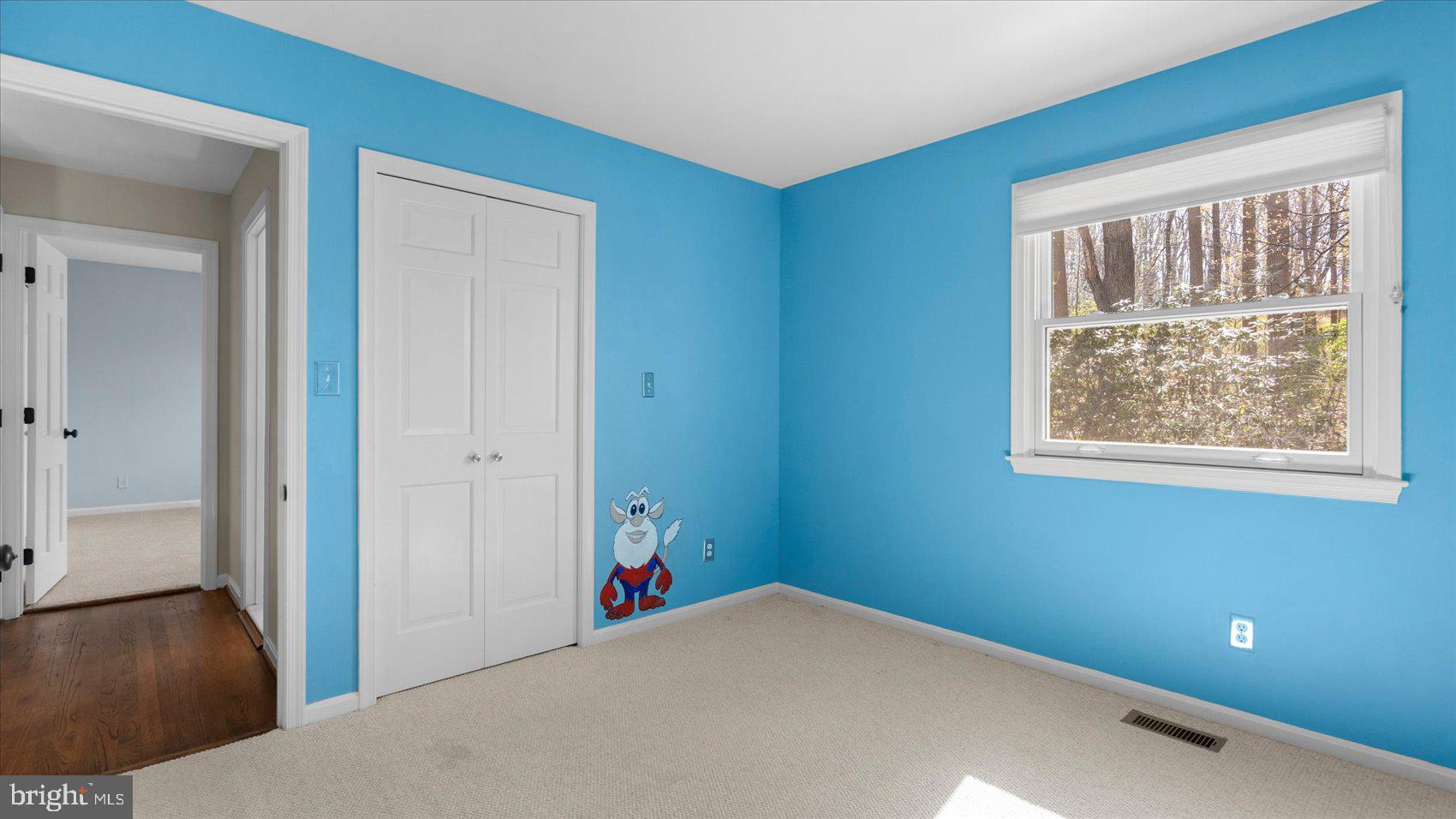 9 Nantucket Garth Phoenix, MD 21131 - Photo 37 of 52 a view of an empty room with wooden floor and a window