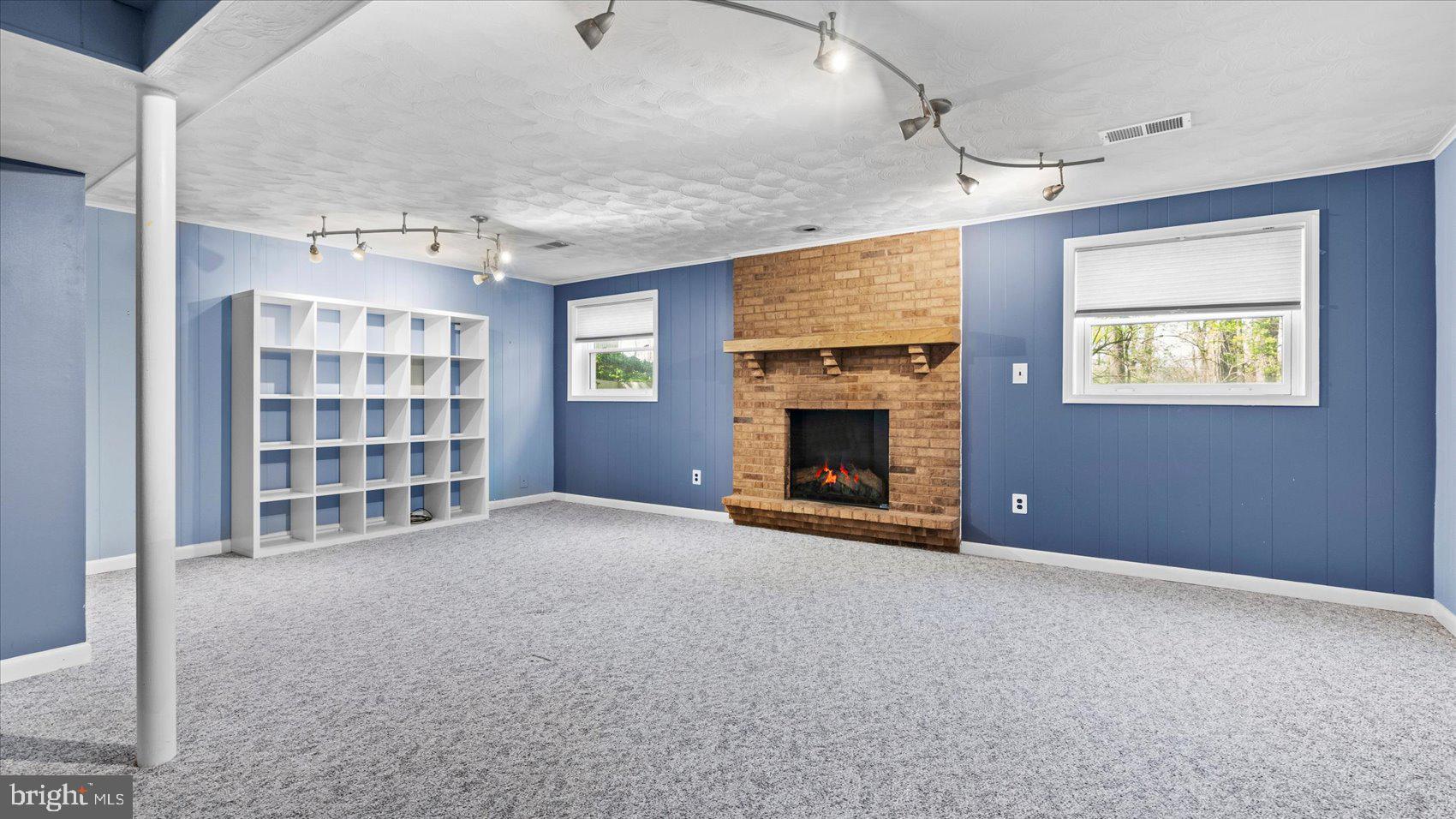 9 Nantucket Garth Phoenix, MD 21131 - Photo 39 of 52 a view of an empty room with a fireplace and a window