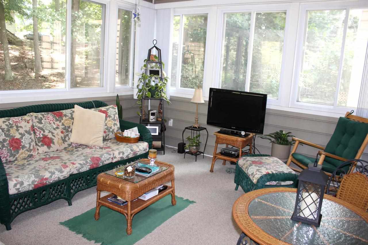 5316 Bentgrass Drive Raleigh, NC 27610 - Photo 11 of 25 This was a later addition to the house, but when you sit out in it, surrounded by windows and views of your back yard, it is impossible to imagine living without it.