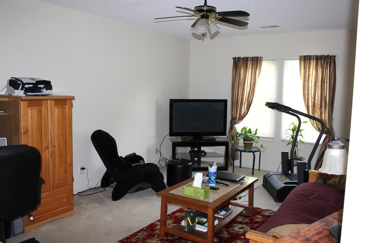 5316 Bentgrass Drive Raleigh, NC 27610 - Photo 17 of 25 Know to some as the "man cave", it makes a great place to escape and catch Sunday's games.