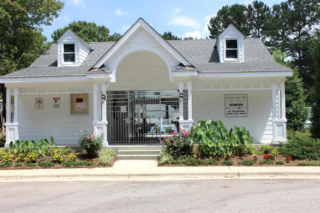 5316 Bentgrass Drive Raleigh, NC 27610 - Photo 23 of 25 The Village Lakes subdivision enjoys this attractive clubhouse as well as a private lake for residents.
