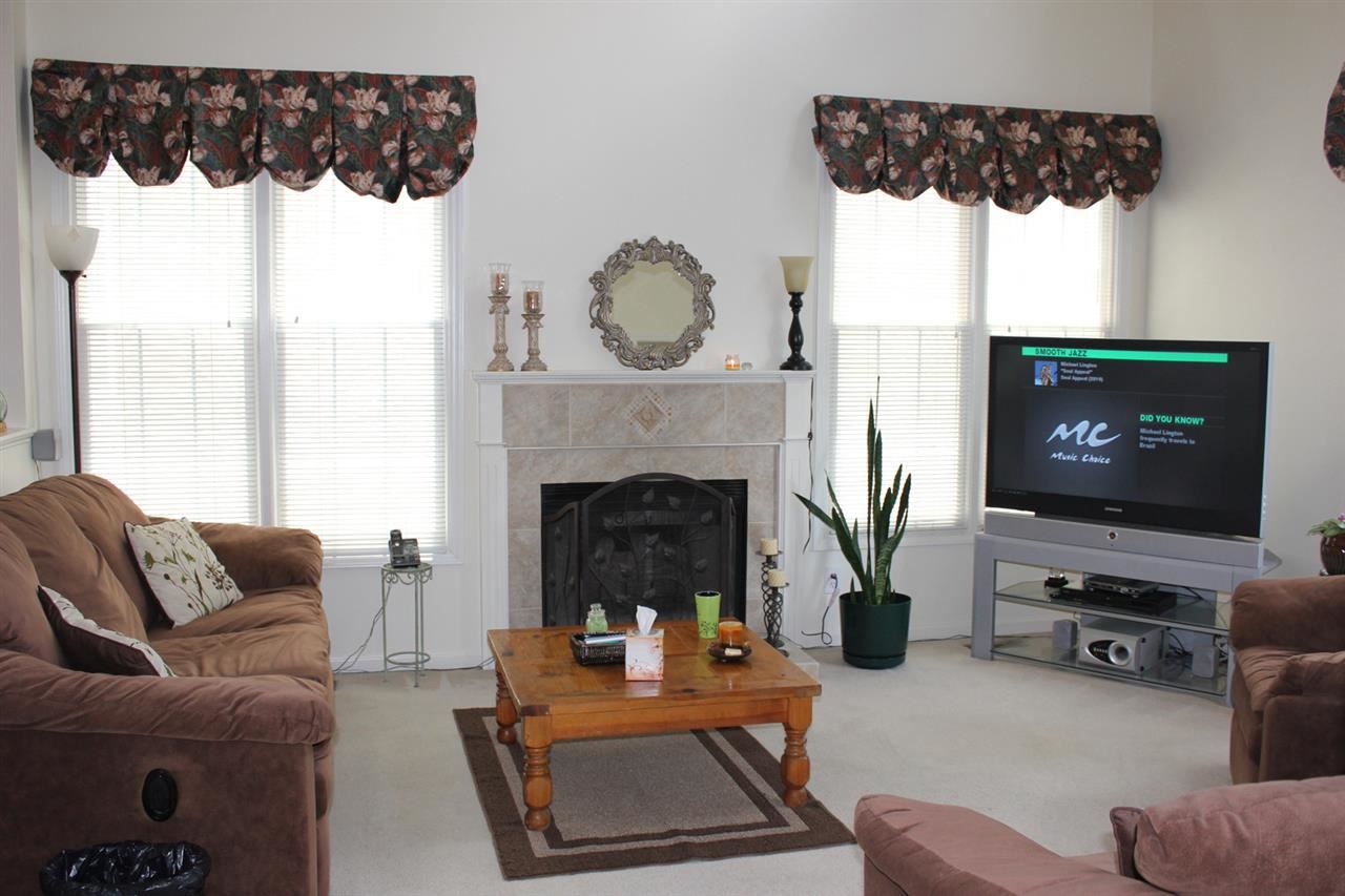 5316 Bentgrass Drive Raleigh, NC 27610 - Photo 6 of 25 This lovely room is open to the kitchen and eat-in area. Its high ceiling gives you a huge appreciation for its space.