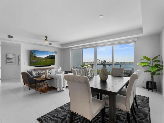 a living room with furniture potted plant and a window