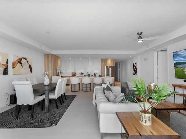 a view of a terrace with couches and sky view