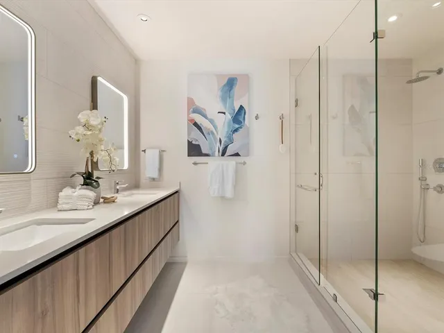 a bedroom with a bed and a mirror