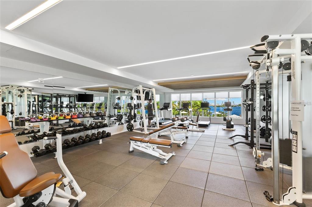1020 Sunset Point Road, Unit 605 Clearwater, FL 33755 - Photo 27 of 35 a view of a room with gym equipment
