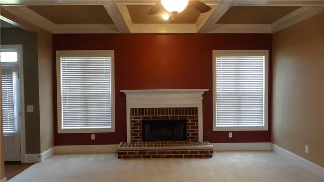 a living room with fireplace windows