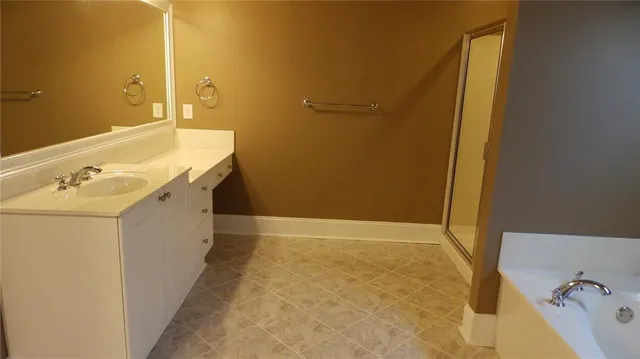 a bathroom with a sink double vanity and a mirror