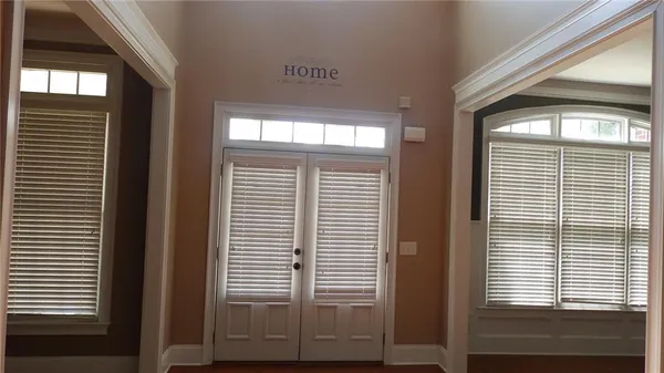 a view of a room that has a large window