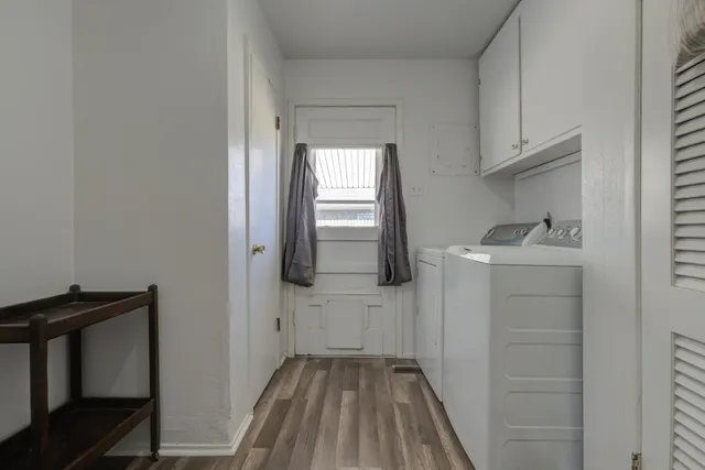 a bathroom with a sink toilet and window