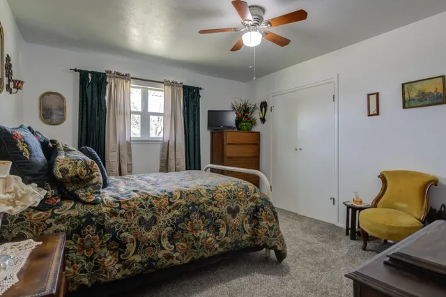a bedroom with a bed and window