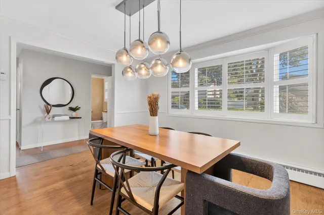 a view of a dining room table and chairs