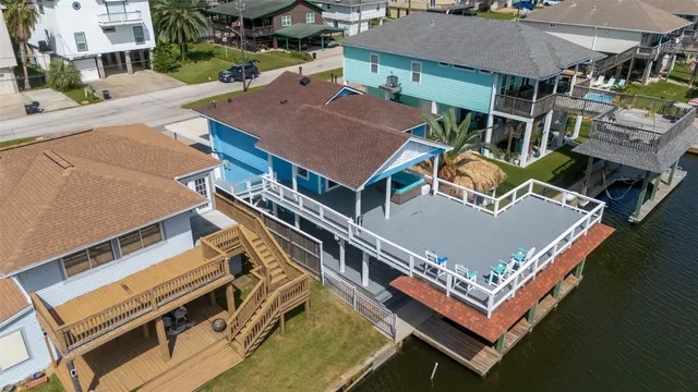 an aerial view of a house with a ocean view