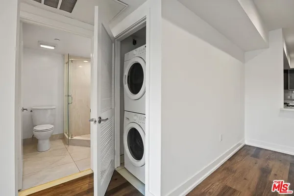 a view of a hallway with washer and dryer