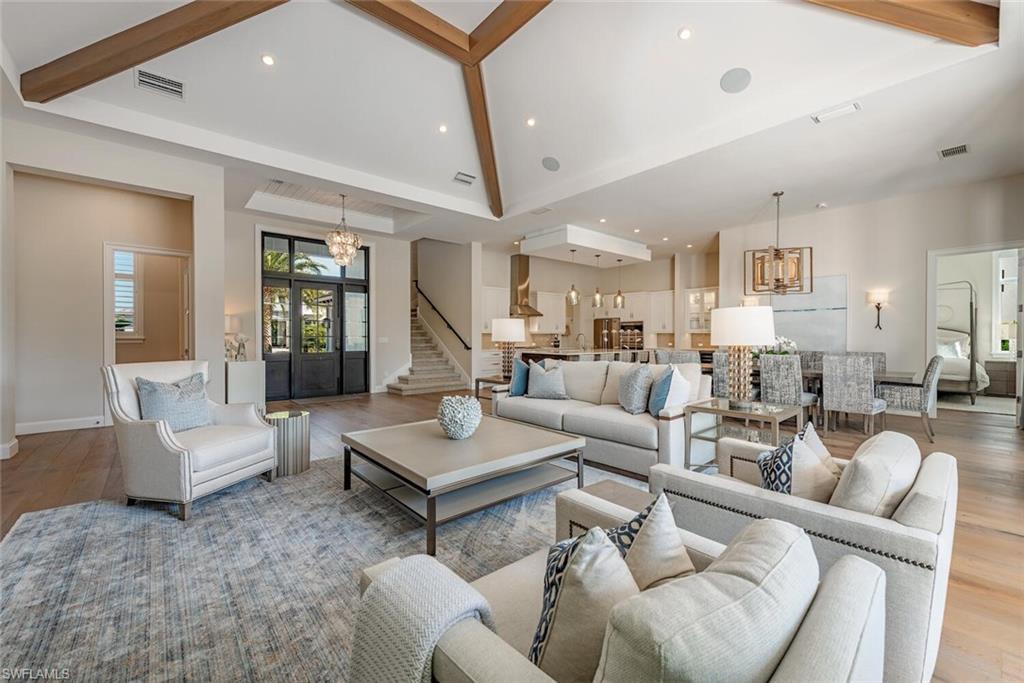 16715 Enclave Circle Naples, FL 34110 - Photo 12 of 33 a living room with furniture and a wooden floor