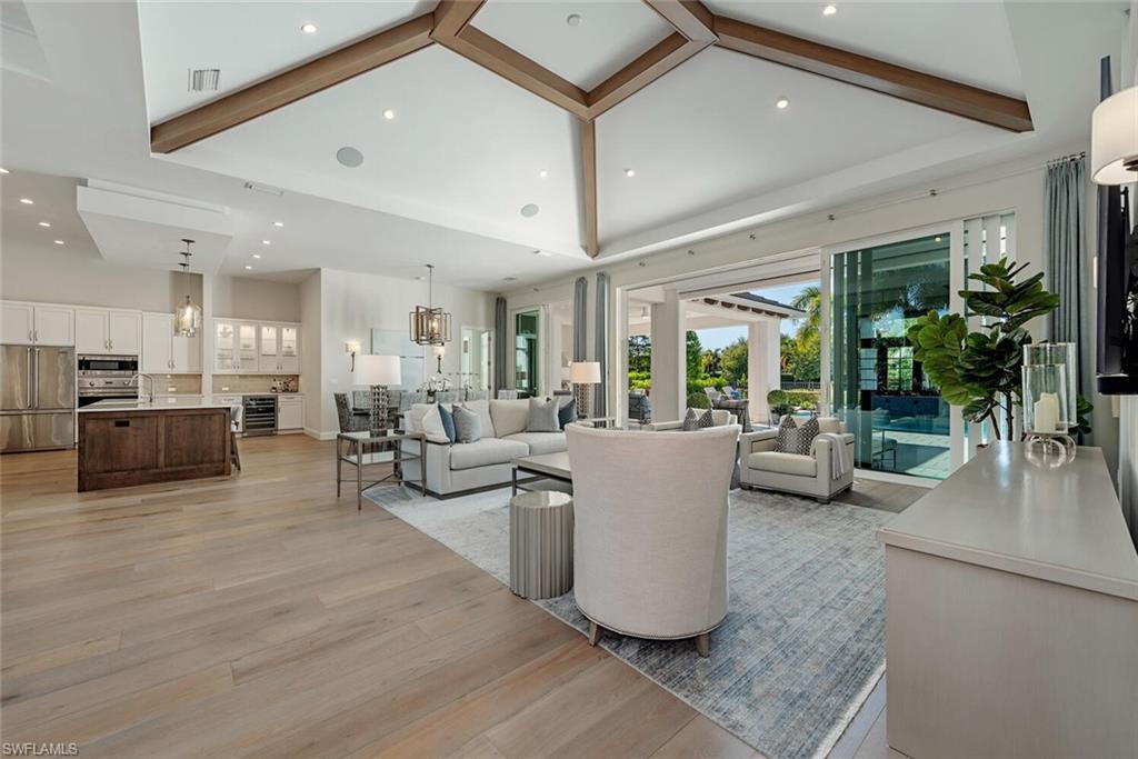 16715 Enclave Circle Naples, FL 34110 - Photo 13 of 33 a living room with furniture and a large window
