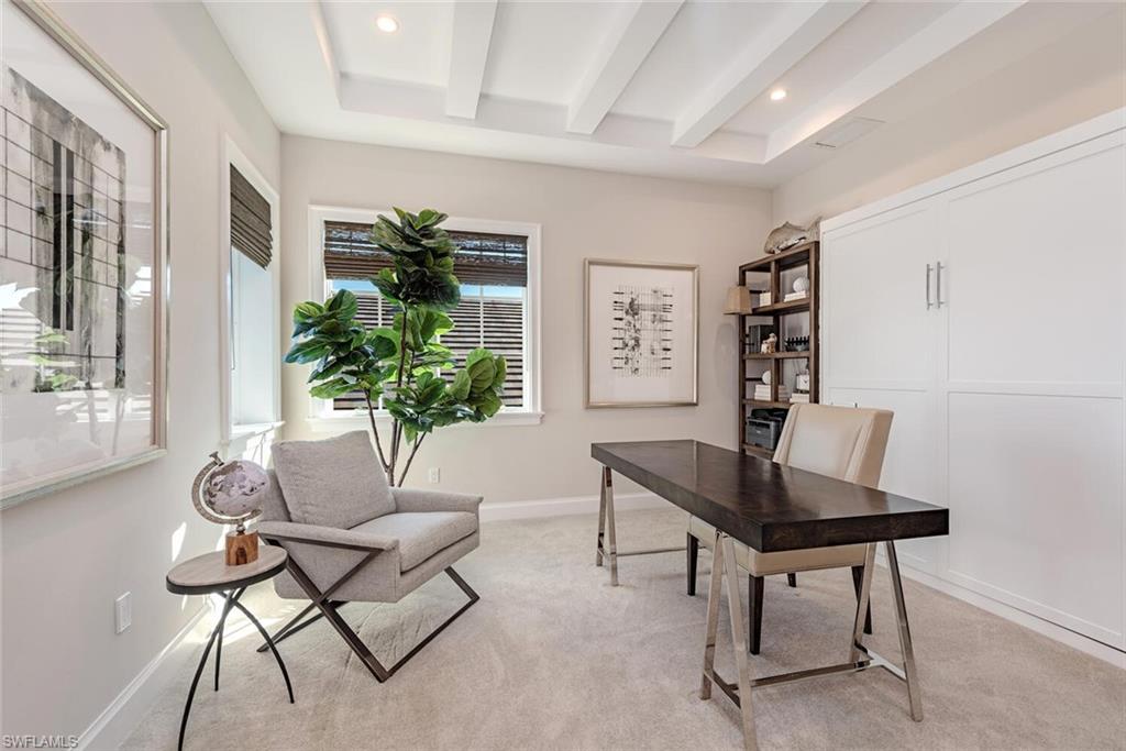 16715 Enclave Circle Naples, FL 34110 - Photo 24 of 33 a workspace with furniture and a potted plant