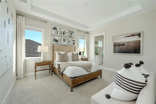 a bedroom with a bed and a couch