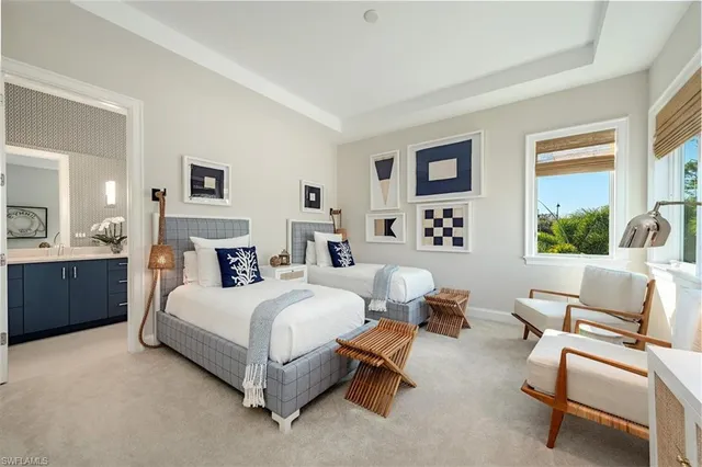 a bedroom with a bed and a couch