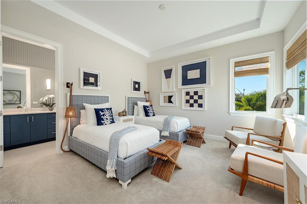 16715 Enclave Circle Naples, FL 34110 - Photo 27 of 33 a bedroom with a bed and a couch