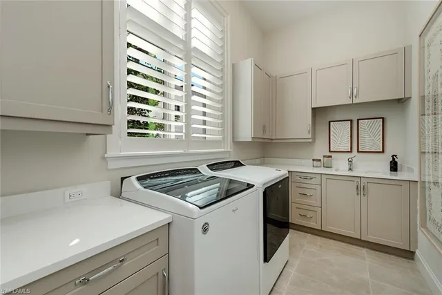 a kitchen that has a sink and a stove in it