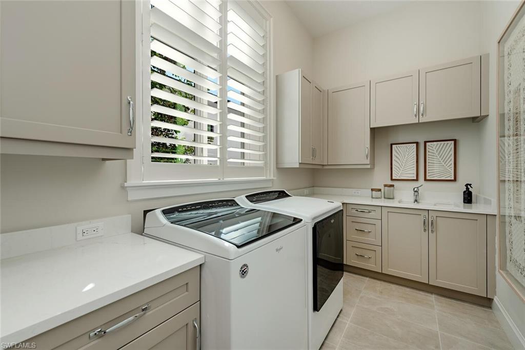 16715 Enclave Circle Naples, FL 34110 - Photo 30 of 33 a kitchen that has a sink and a stove in it