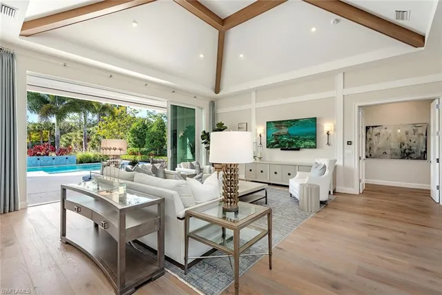 a very nice looking living room with a large window