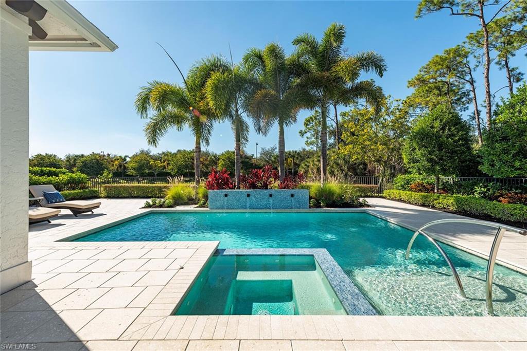 16715 Enclave Circle Naples, FL 34110 - Photo 5 of 33 a view of backyard with swimming pool and seating space