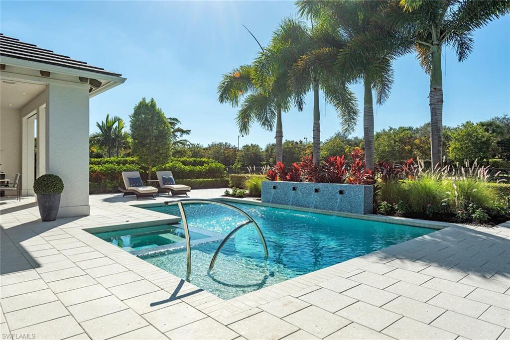 16715 Enclave Circle Naples, FL 34110 - Photo 6 of 33 a view of a backyard with plants and swimming pool