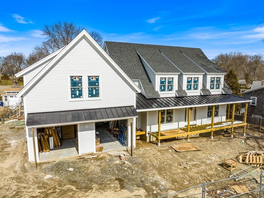 9 Wompatuck Road Hingham, MA 02043 - Photo 1 of 24 a front view of a house with a yard