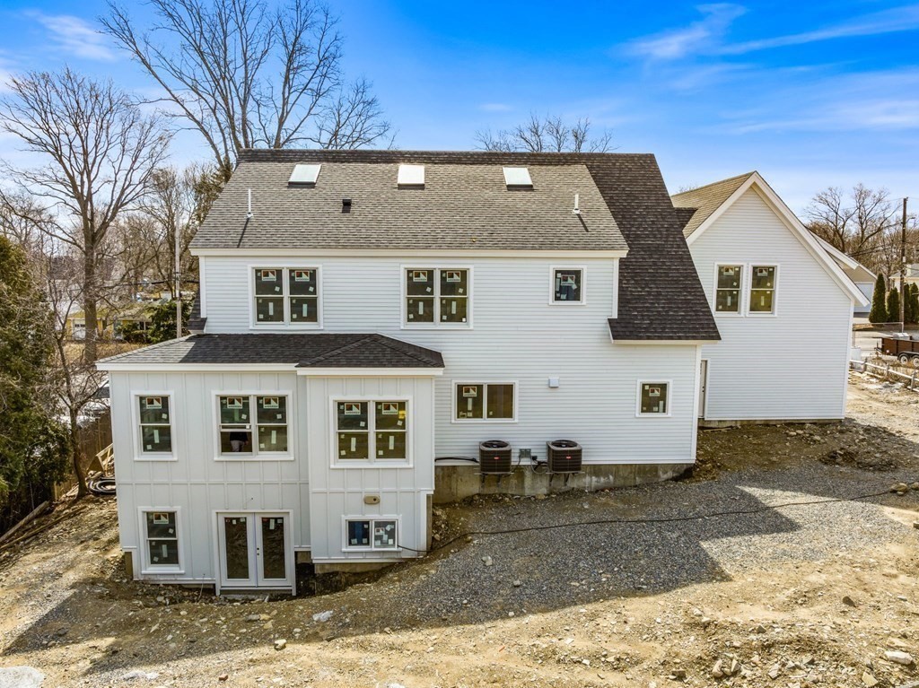 9 Wompatuck Road Hingham, MA 02043 - Photo 2 of 24 a front view of a house with a yard