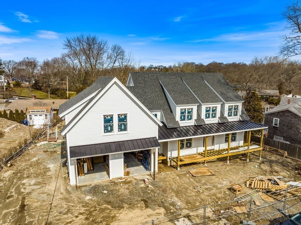 9 Wompatuck Road Hingham, MA 02043 - Photo 21 of 24 a front view of a house with a yard