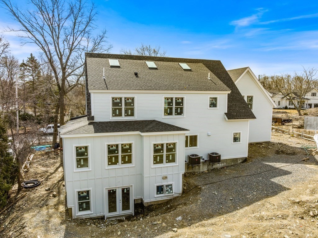 9 Wompatuck Road Hingham, MA 02043 - Photo 22 of 24 a view of a blue house with a yard