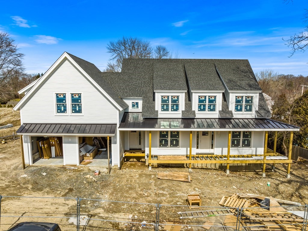 9 Wompatuck Road Hingham, MA 02043 - Photo 24 of 24 a front view of a house with a large window and a yard