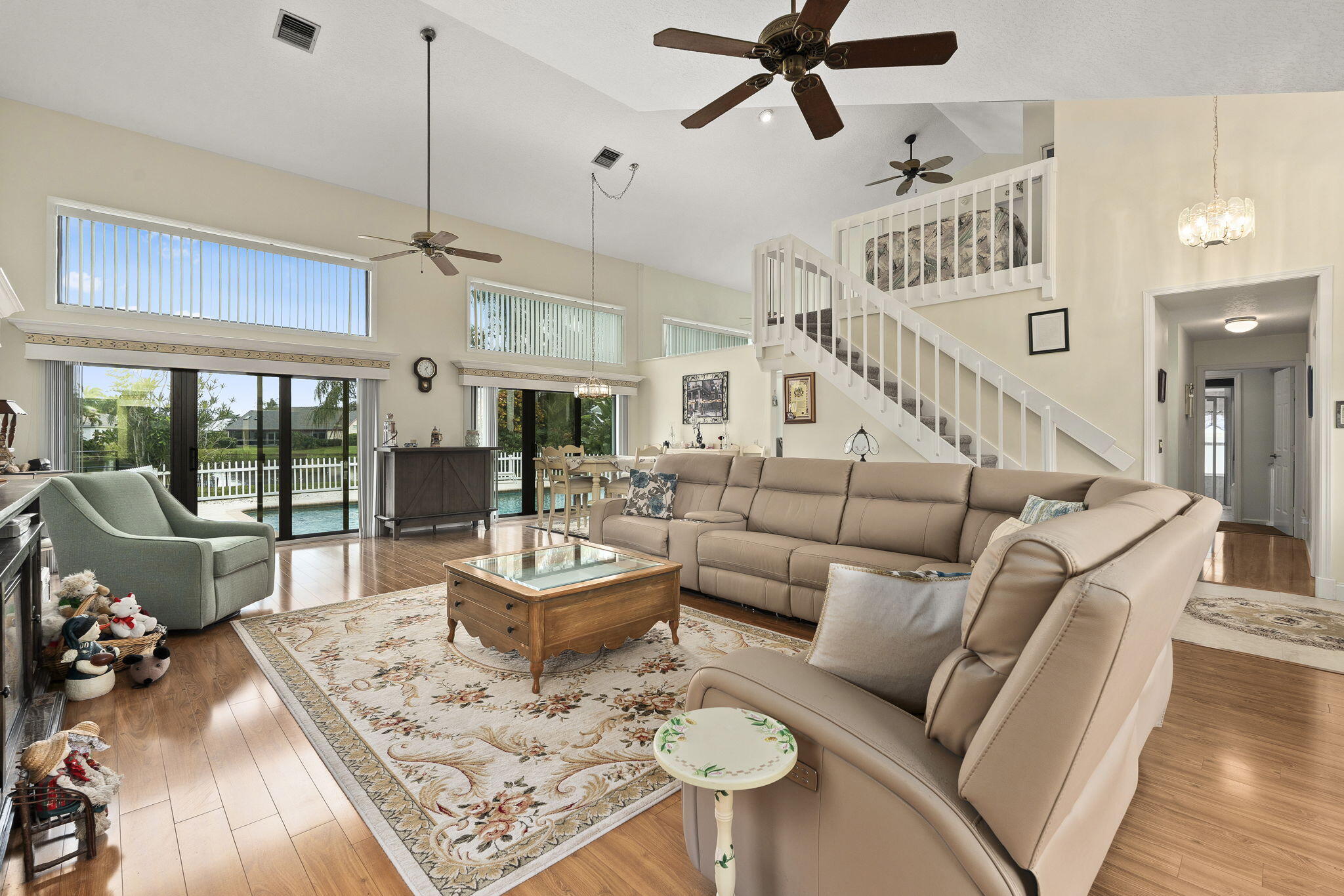 8964 Southeast Sunfish Place Hobe Sound, FL 33455 - Photo 11 of 51 a living room with furniture and a large window