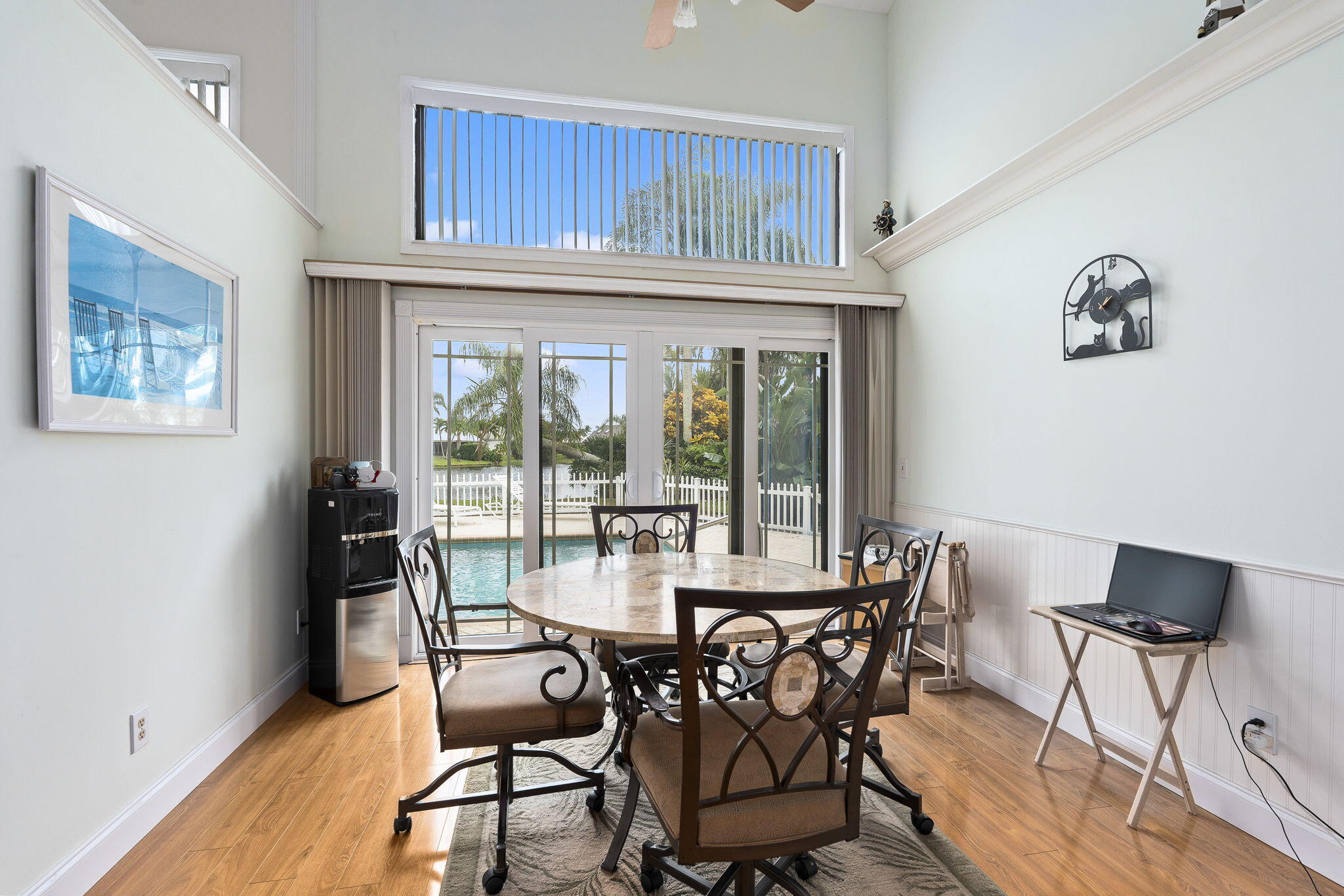 8964 Southeast Sunfish Place Hobe Sound, FL 33455 - Photo 13 of 51 a dining room with furniture and wooden floor
