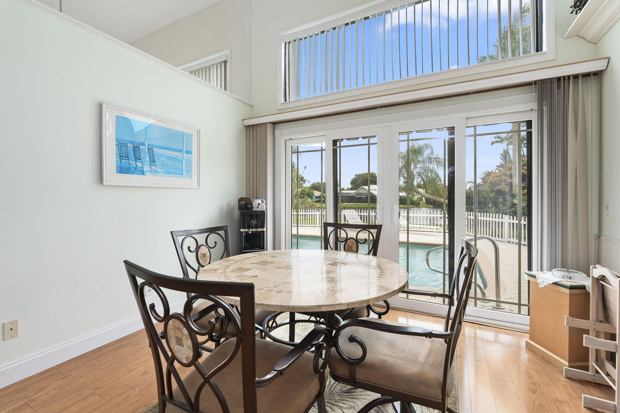 8964 Southeast Sunfish Place Hobe Sound, FL 33455 - Photo 14 of 51 a view of a dining room with furniture window and outside view