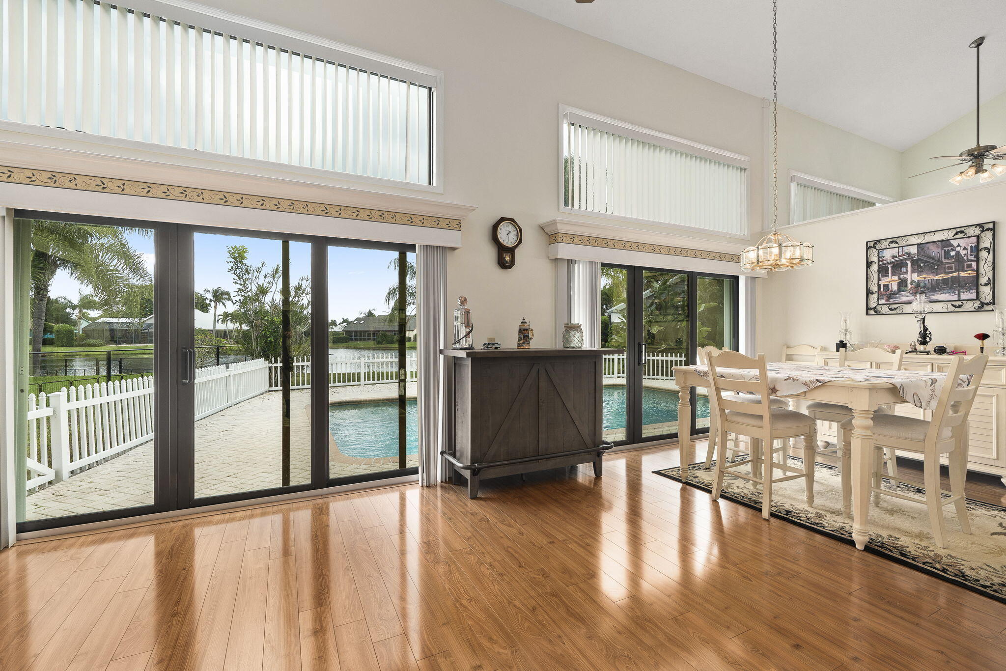 8964 Southeast Sunfish Place Hobe Sound, FL 33455 - Photo 17 of 51 a living room with lots of furniture and a large window