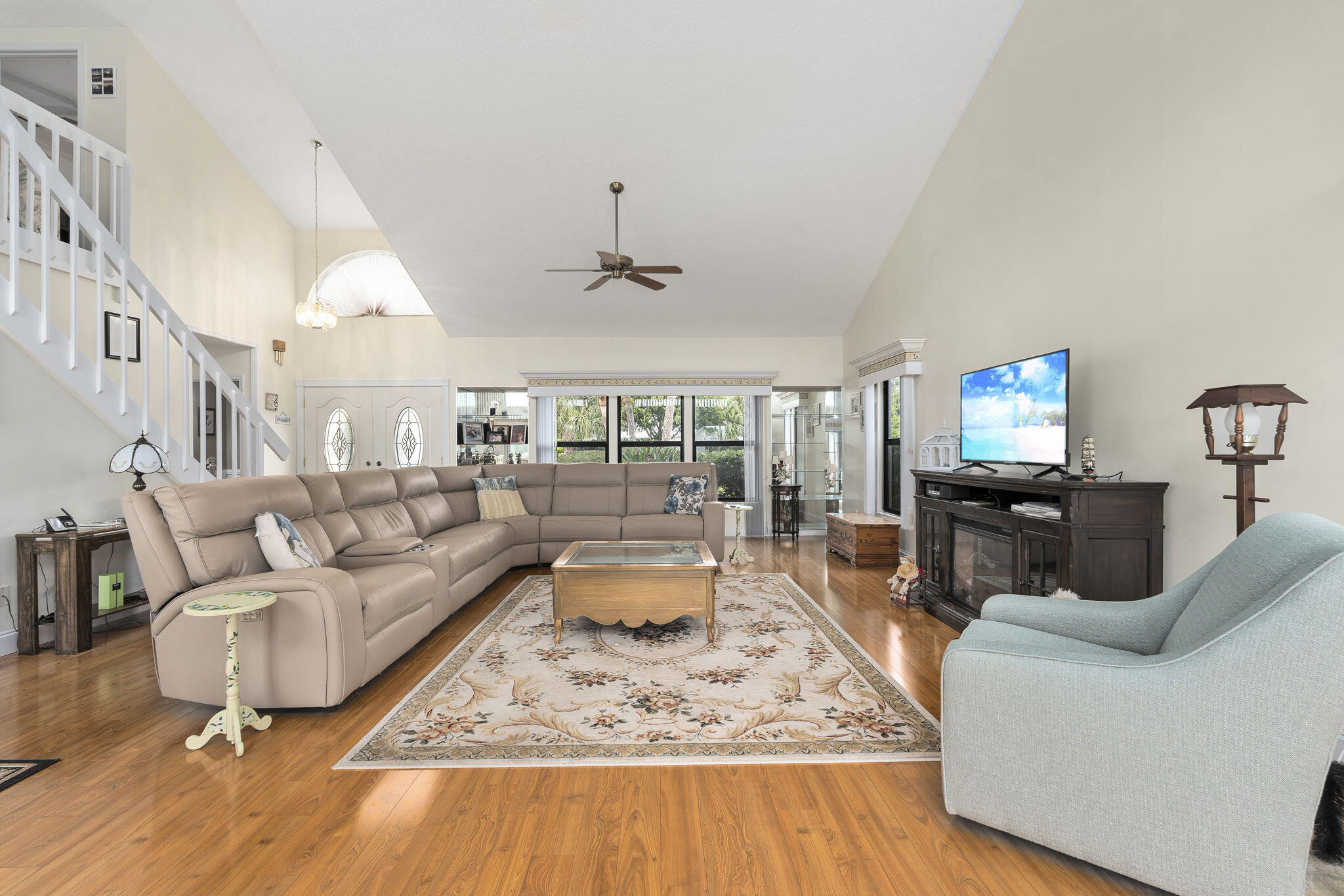 8964 Southeast Sunfish Place Hobe Sound, FL 33455 - Photo 18 of 51 a living room with furniture and a wooden floor