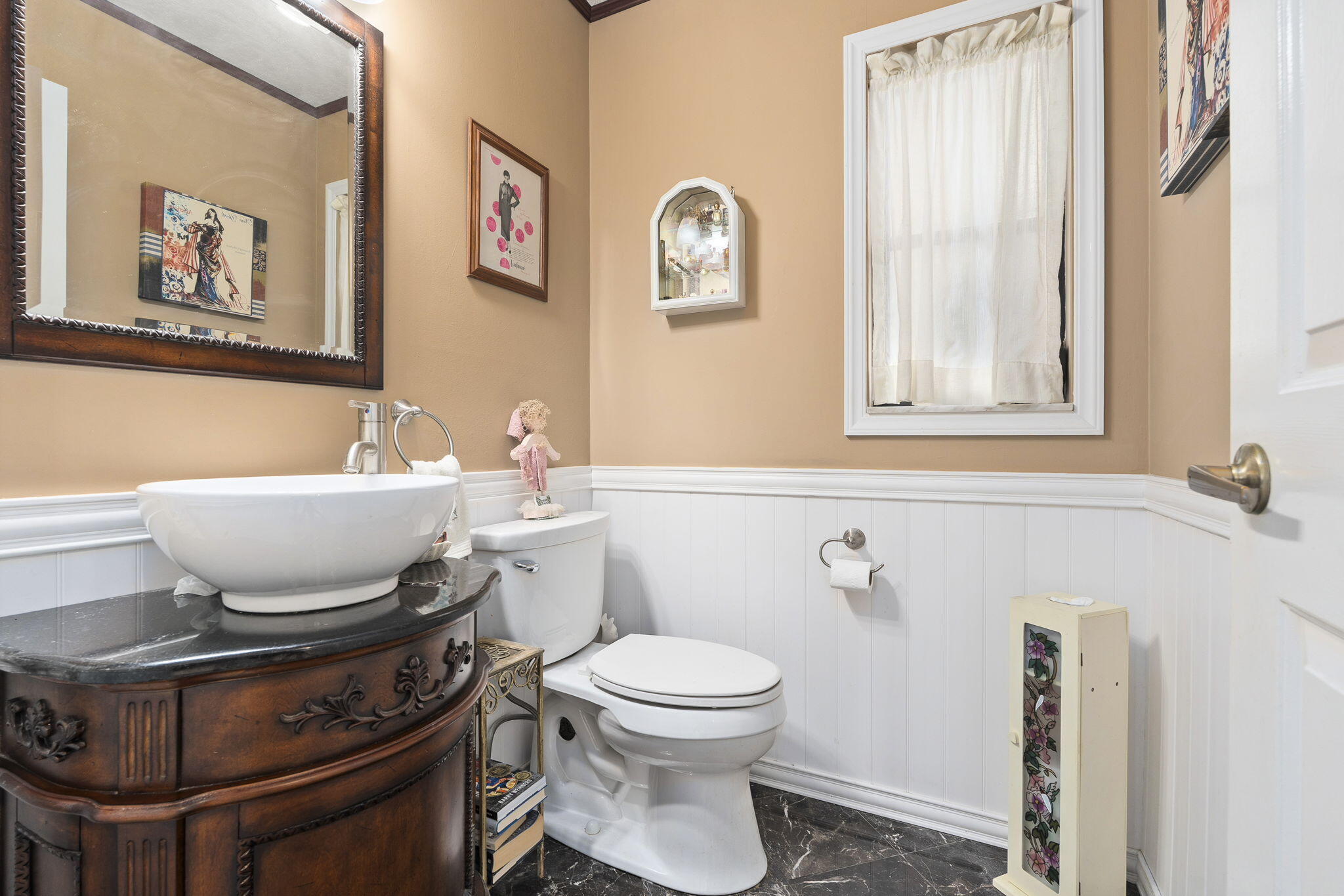 8964 Southeast Sunfish Place Hobe Sound, FL 33455 - Photo 29 of 51 a bathroom with a toilet a sink and a mirror