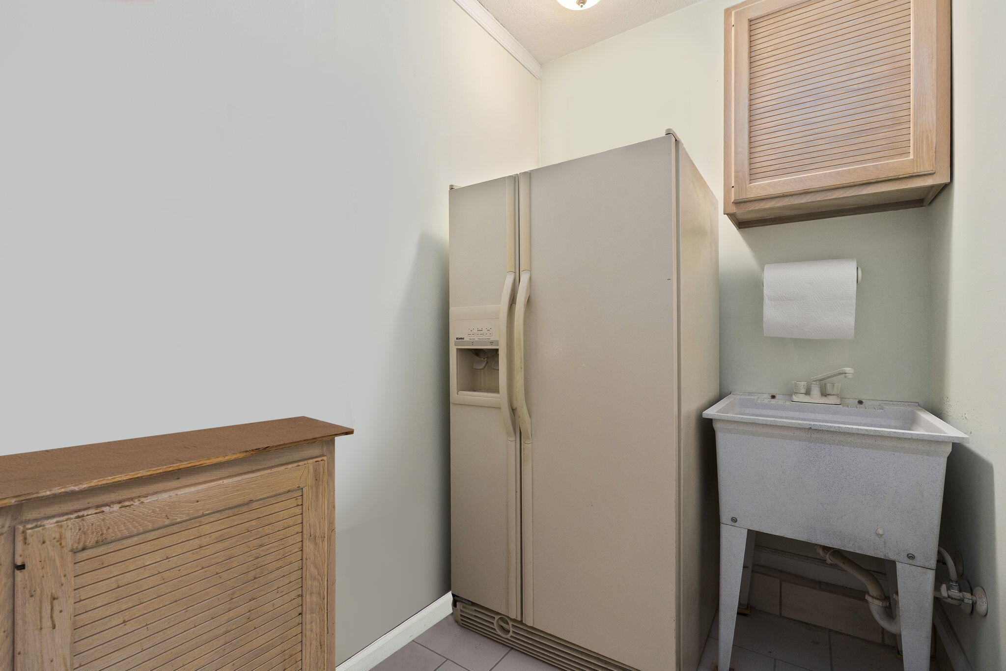 8964 Southeast Sunfish Place Hobe Sound, FL 33455 - Photo 36 of 51 a room with storage and utility