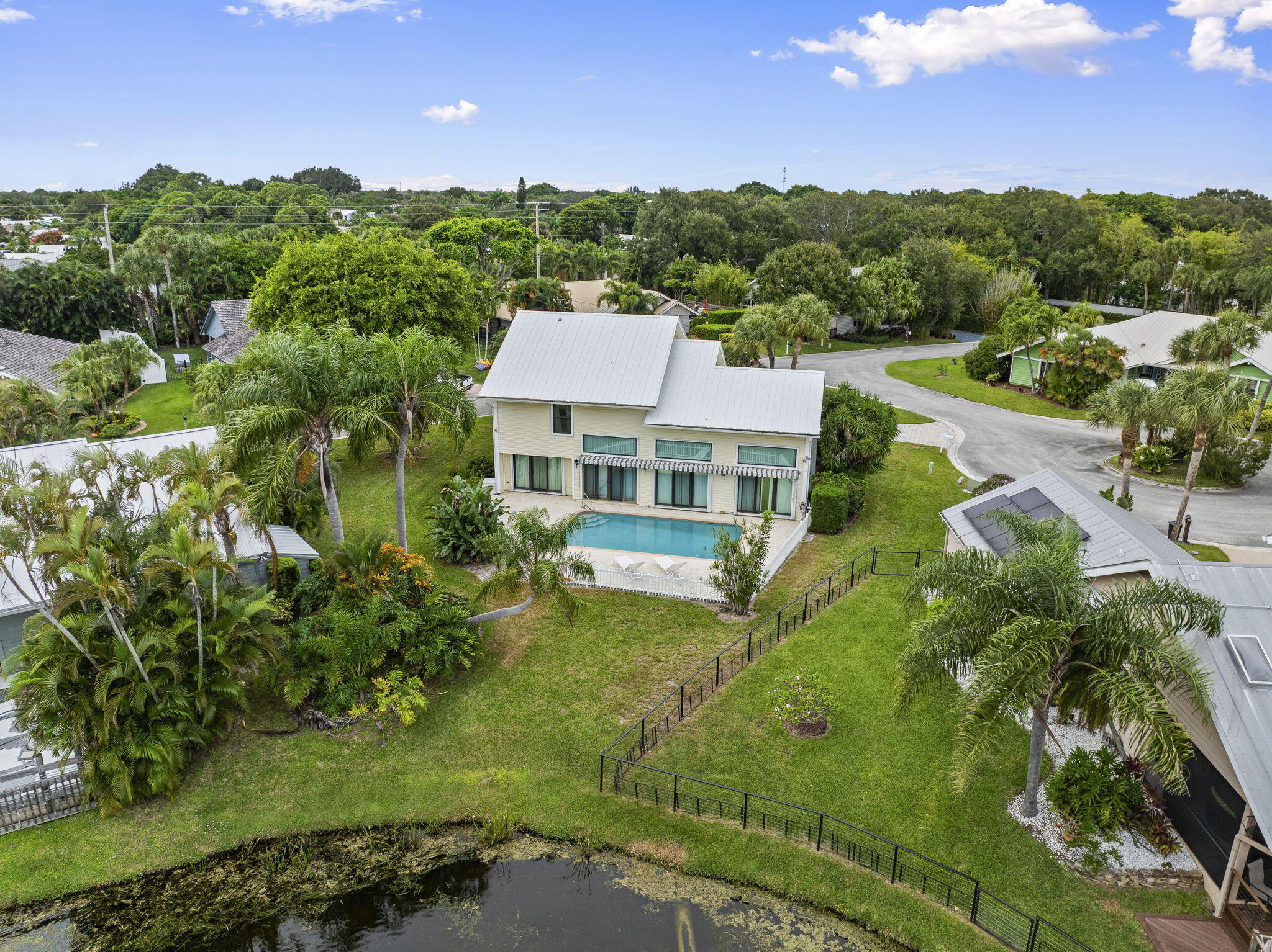 8964 Southeast Sunfish Place Hobe Sound, FL 33455 - Photo 49 of 51 a aerial view of a house with a yard