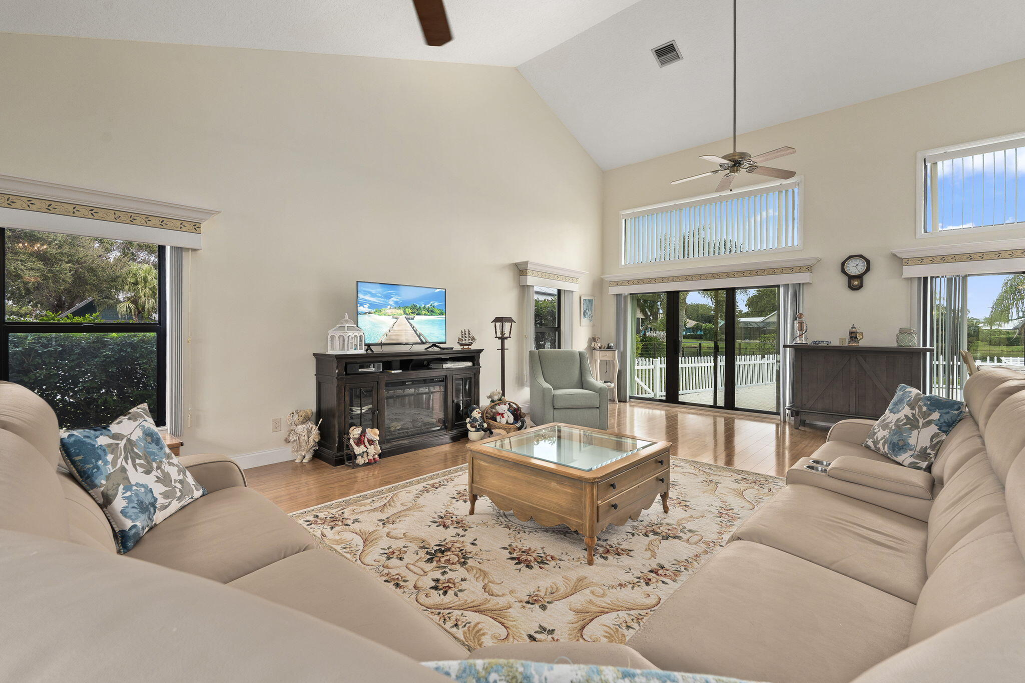 8964 Southeast Sunfish Place Hobe Sound, FL 33455 - Photo 10 of 51 a living room with furniture and a large window