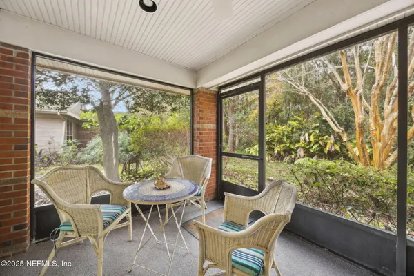 a outdoor dining space with furniture and outdoor view