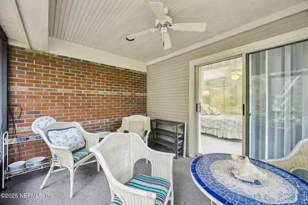 a view of a dining room with furniture wooden floor and a chandelier