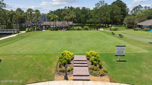 a view of a park with a sign board