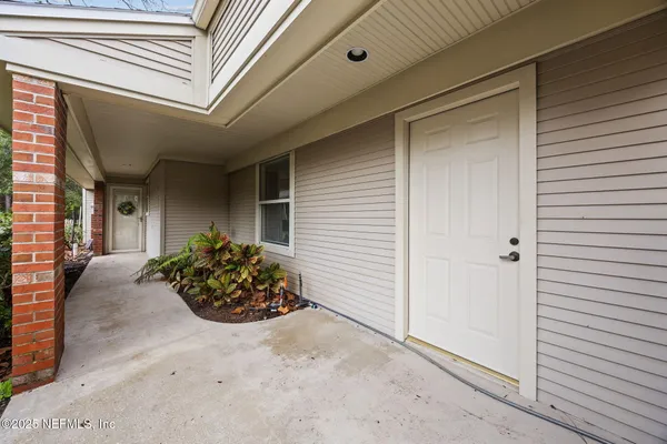 a view of a entryway door front of house