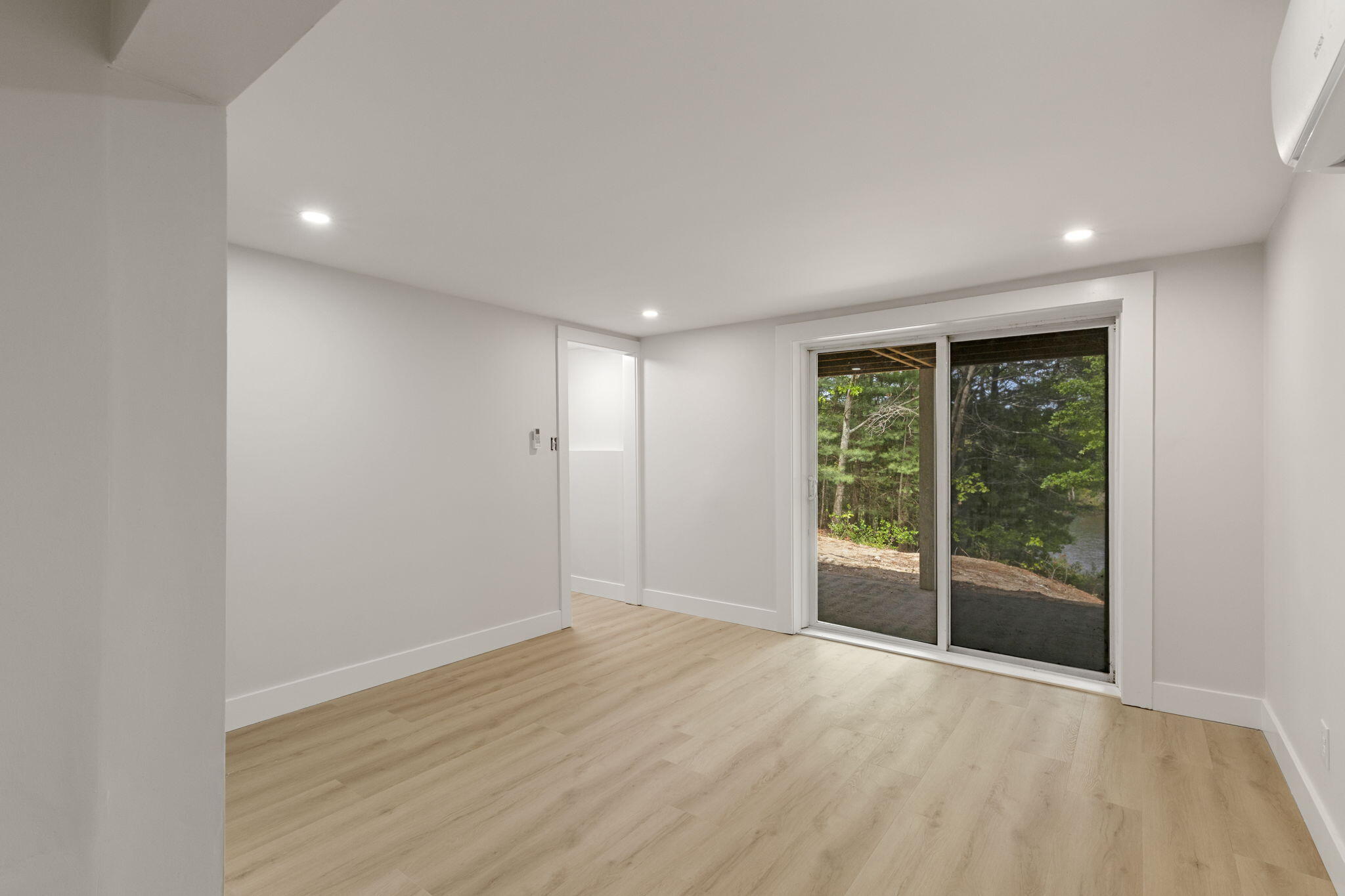 81 Sam Turner Road East Falmouth, MA 02536 - Photo 33 of 37 a view of an empty room with wooden floor and a window