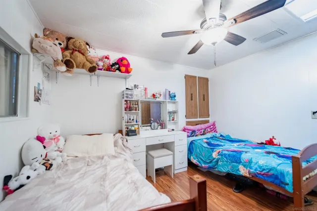 a bedroom with a bed furniture and a chandelier